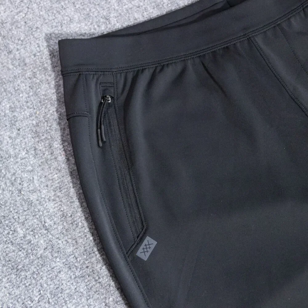 Rhone Warm Up Tech Jogger Pants Men's Large Black Performance Stretch Zip Pocket